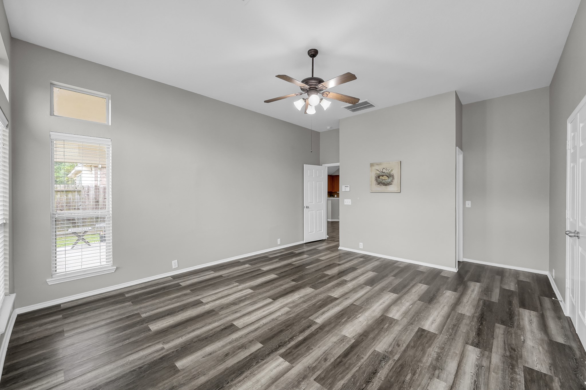 30206 Mesa Valley Drive Spring, TX 77386 - Photo 19 of 38 a view of empty room with wooden floor and fan