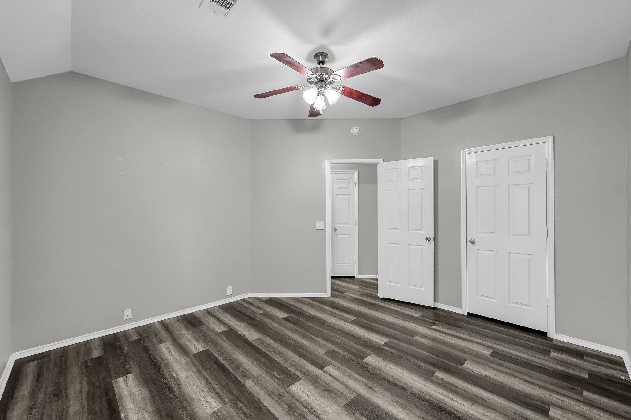 30206 Mesa Valley Drive Spring, TX 77386 - Photo 25 of 38 a view of a livingroom with a ceiling fan and wooden floor