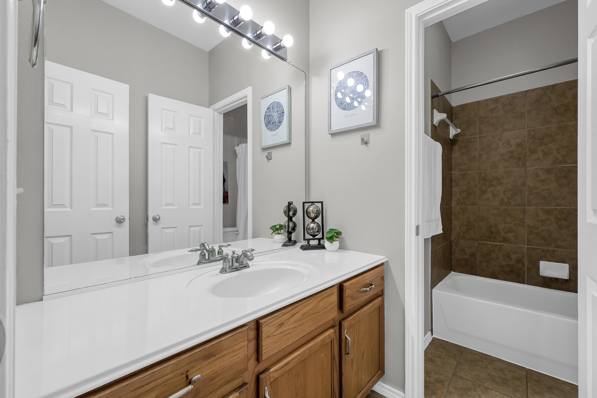 30206 Mesa Valley Drive Spring, TX 77386 - Photo 26 of 38 a bathroom with a sink double vanity granite tub shower and a mirror