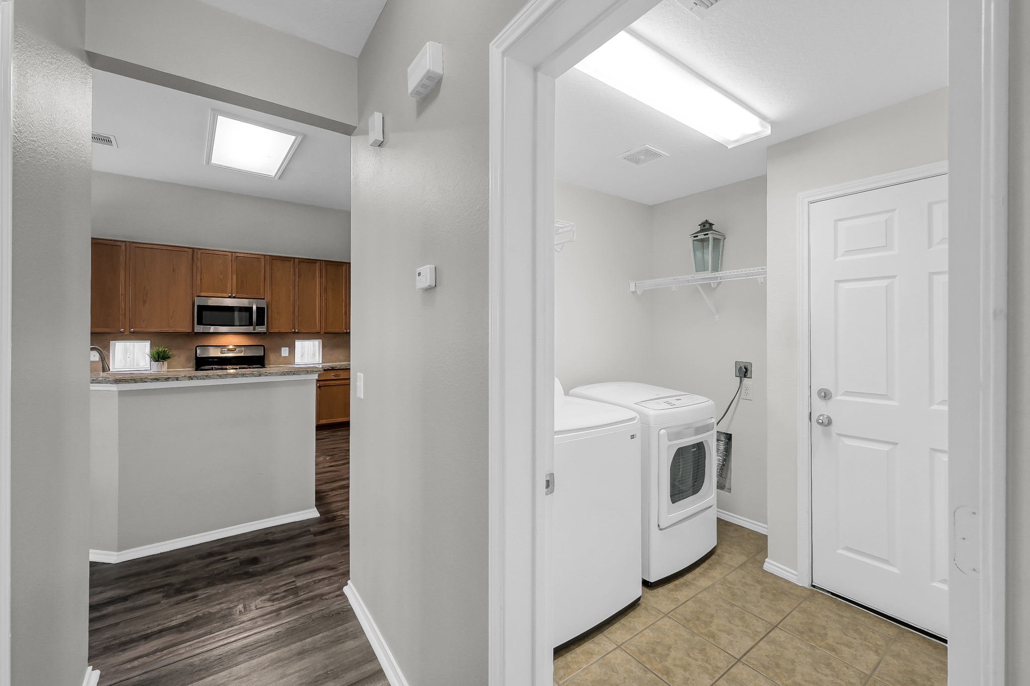 30206 Mesa Valley Drive Spring, TX 77386 - Photo 29 of 38 a view of a hallway with washer and dryer