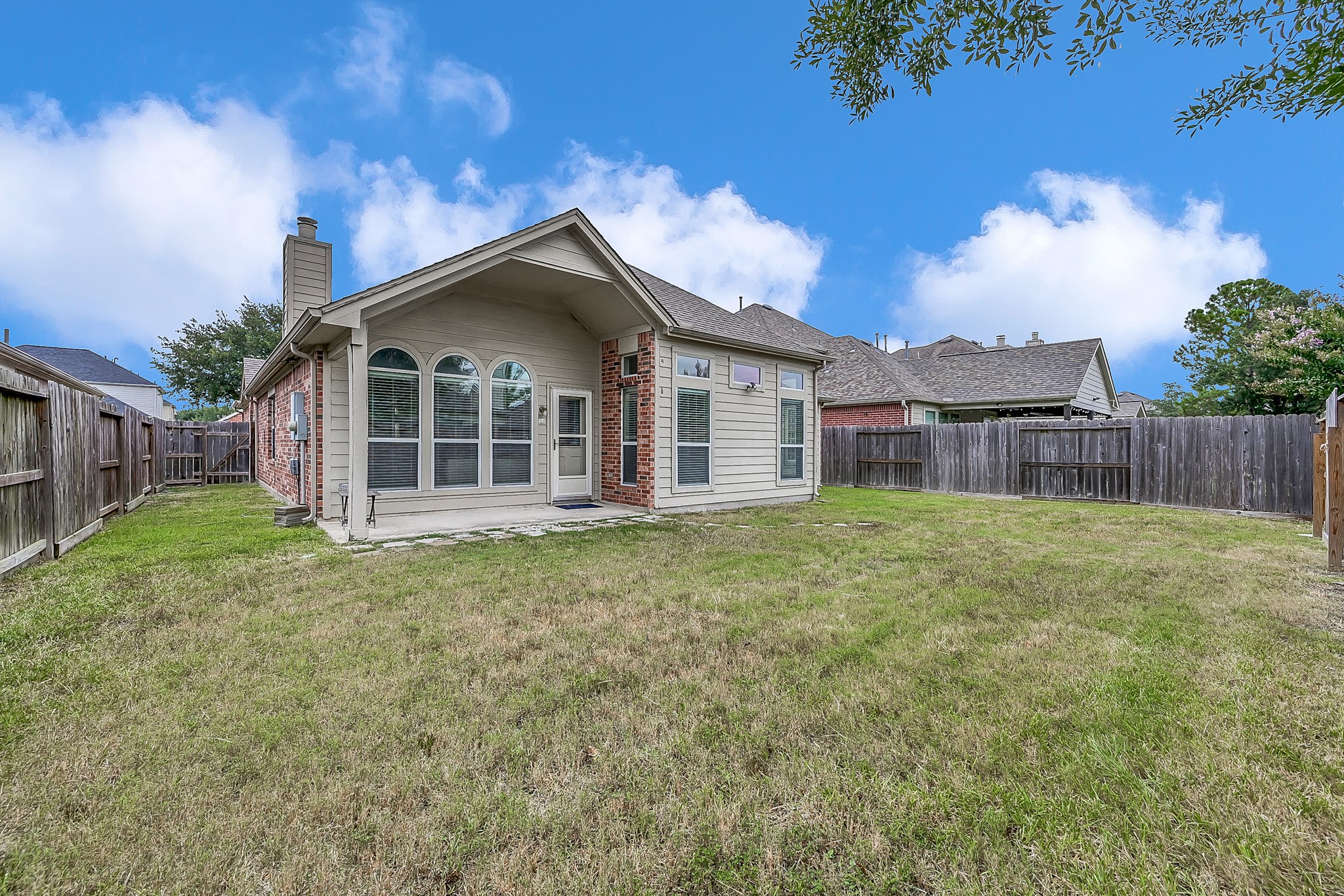 30206 Mesa Valley Drive Spring, TX 77386 - Photo 32 of 38 a view of a house with a backyard