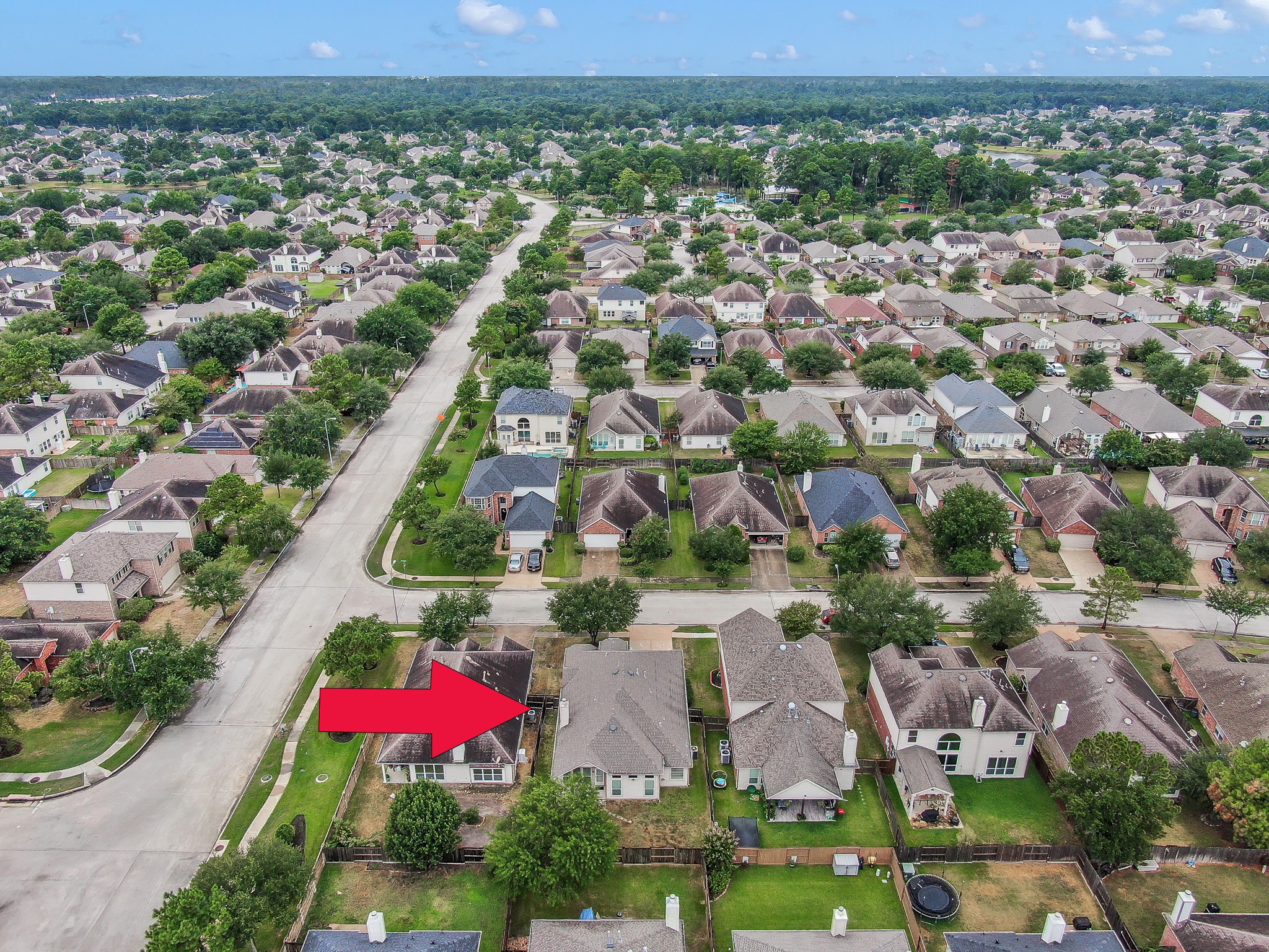 30206 Mesa Valley Drive Spring, TX 77386 - Photo 37 of 38 an aerial view of residential houses with outdoor space and parking