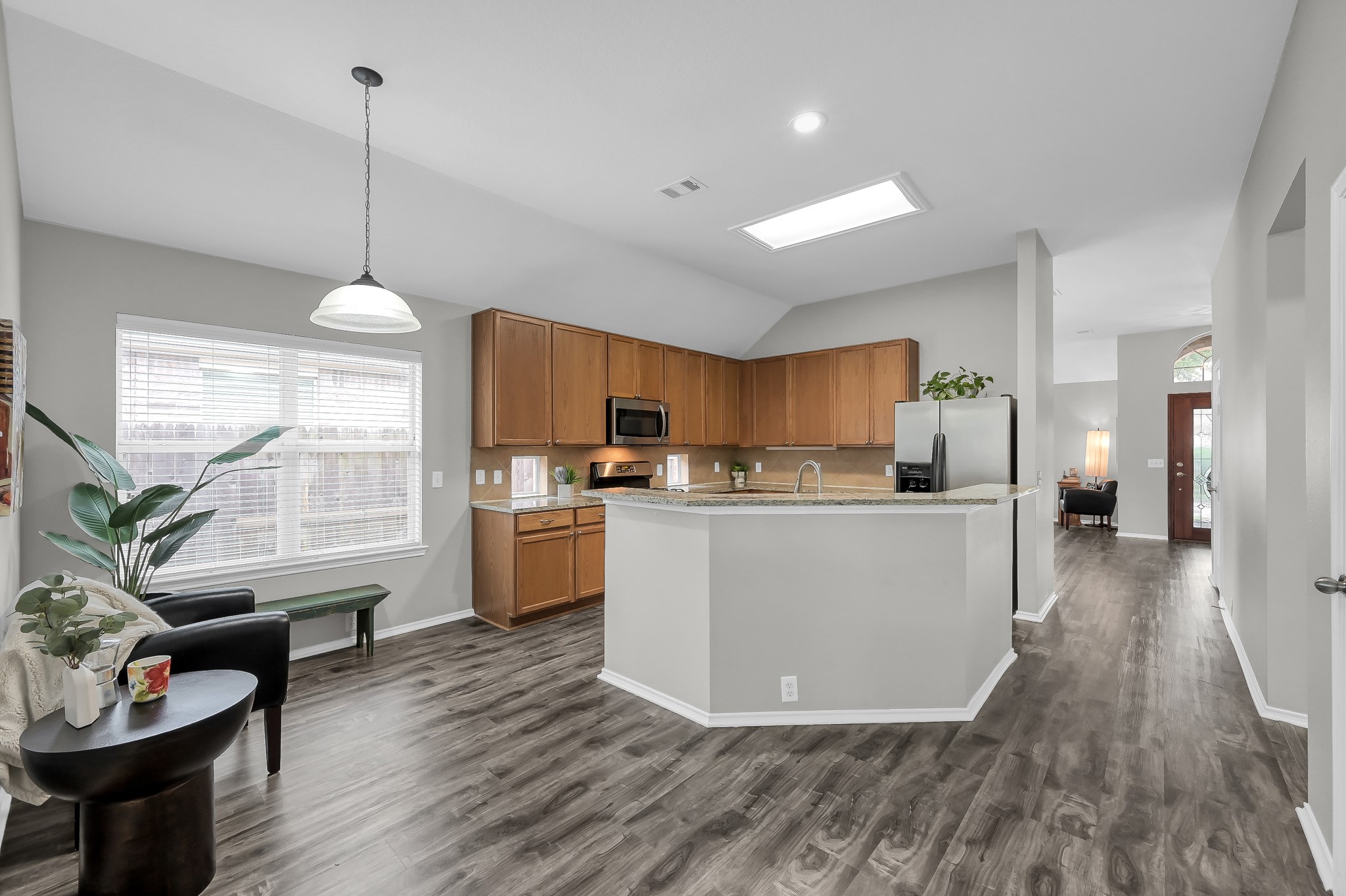 30206 Mesa Valley Drive Spring, TX 77386 - Photo 9 of 38 a living room with furniture and kitchen view