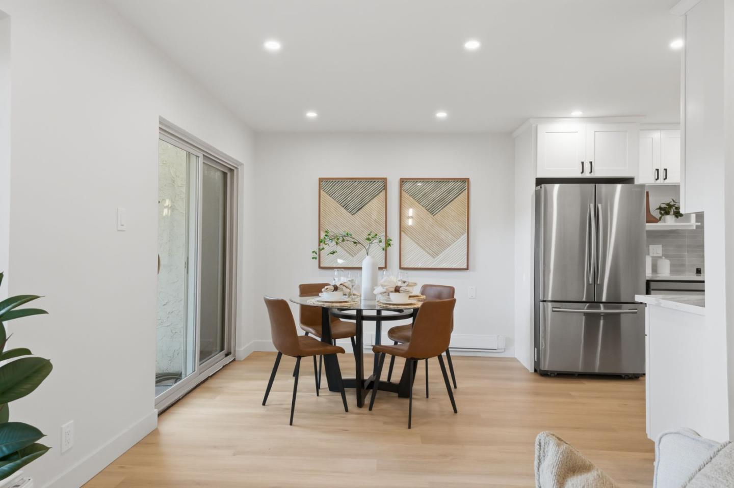 409 Puerto Place Hayward, CA 94541 - Photo 19 of 54 a view of a dining room with furniture window and wooden floor