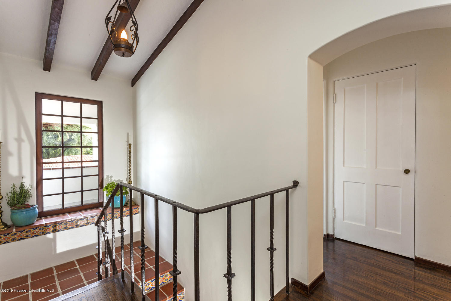 626 Chaucer Road San Marino, CA 91108 - Photo 16 of 31 a view of a hallway with wooden floor and staircase