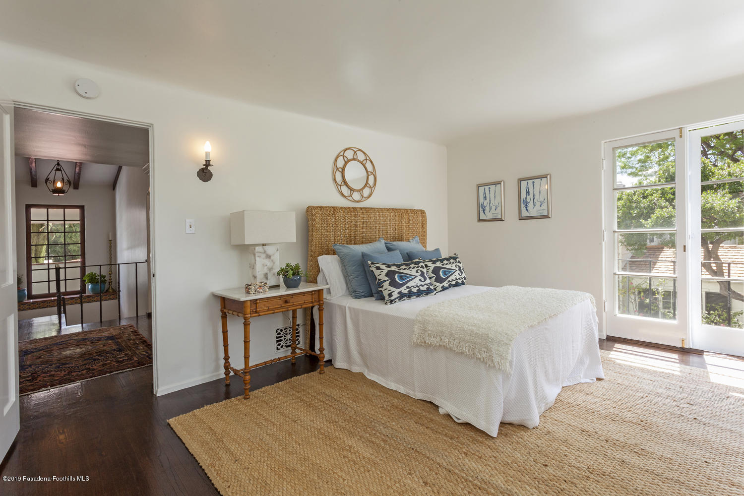 626 Chaucer Road San Marino, CA 91108 - Photo 23 of 31 a bedroom with a large bed and a wooden floor