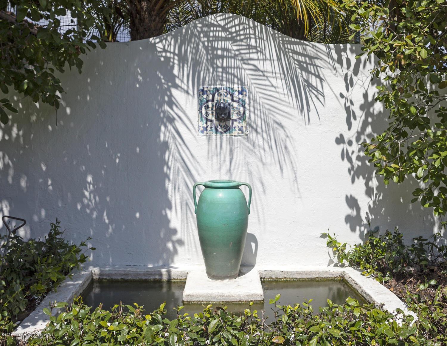 626 Chaucer Road San Marino, CA 91108 - Photo 29 of 31 a view of a potted plant in front of a house