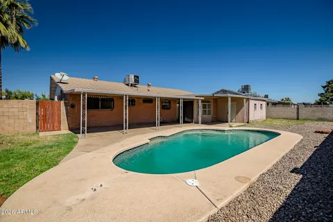 a view of a house with a swimming pool