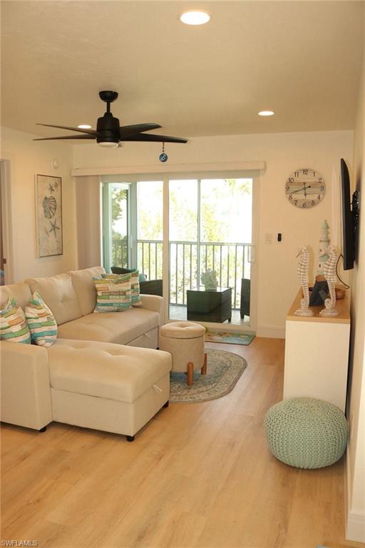 2235 San Marco Road, Unit 5204 Marco Island, FL 34145 - Photo 20 of 34 Living area with light wood-finish flooring, recessed ceiling lighting, and a modern ceiling fan
