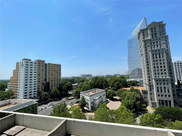 a picture of a bench in front of a wall
