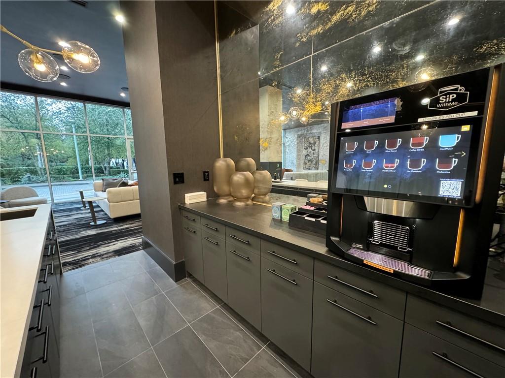 3324 Peachtree Road Northeast, Unit 908 Atlanta, GA 30326 - Photo 35 of 46 a kitchen with stainless steel appliances lots of counter space and a sink