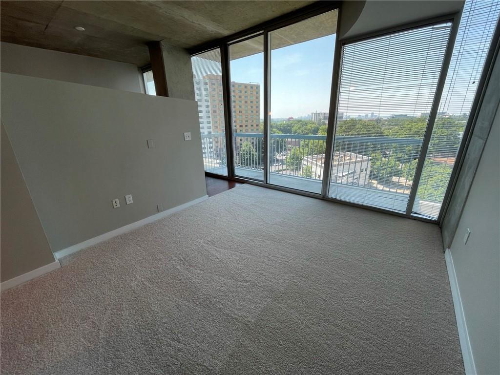 3324 Peachtree Road Northeast, Unit 908 Atlanta, GA 30326 - Photo 9 of 46 a view of an empty room with a large window