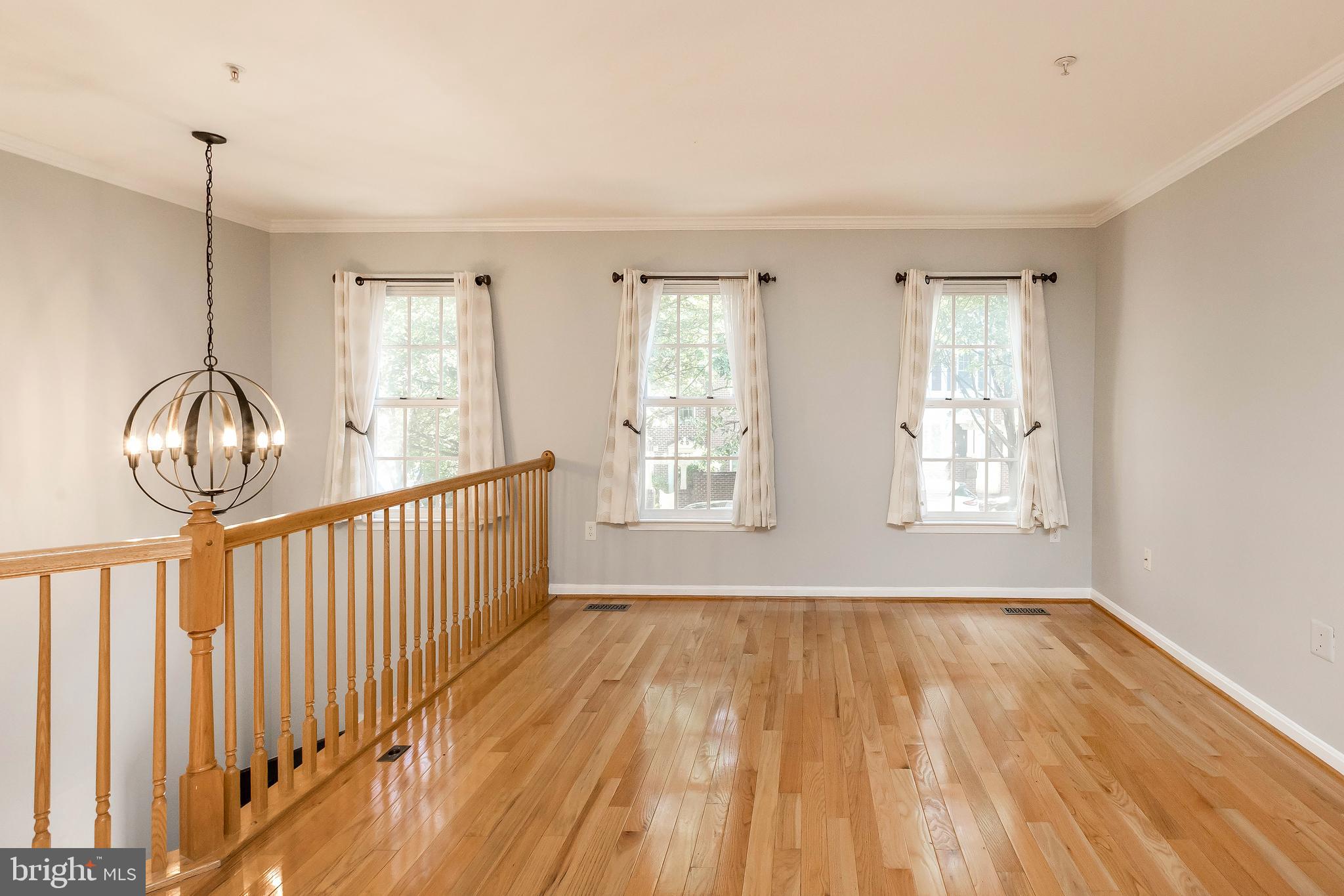 205 Ridgepoint Place Gaithersburg, MD 20878 - Photo 14 of 51 a view of empty room with wooden floor and fan