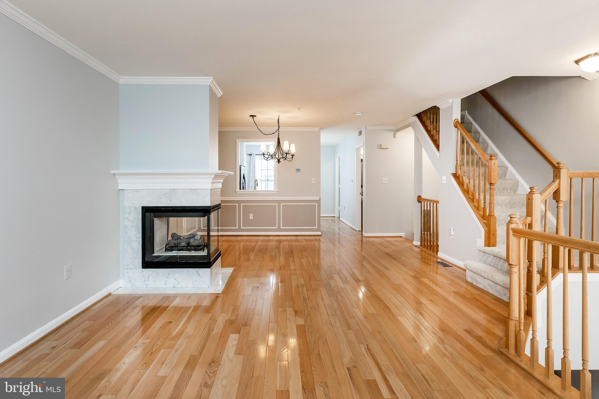 205 Ridgepoint Place Gaithersburg, MD 20878 - Photo 15 of 51 a view of empty room with wooden floor and fireplace