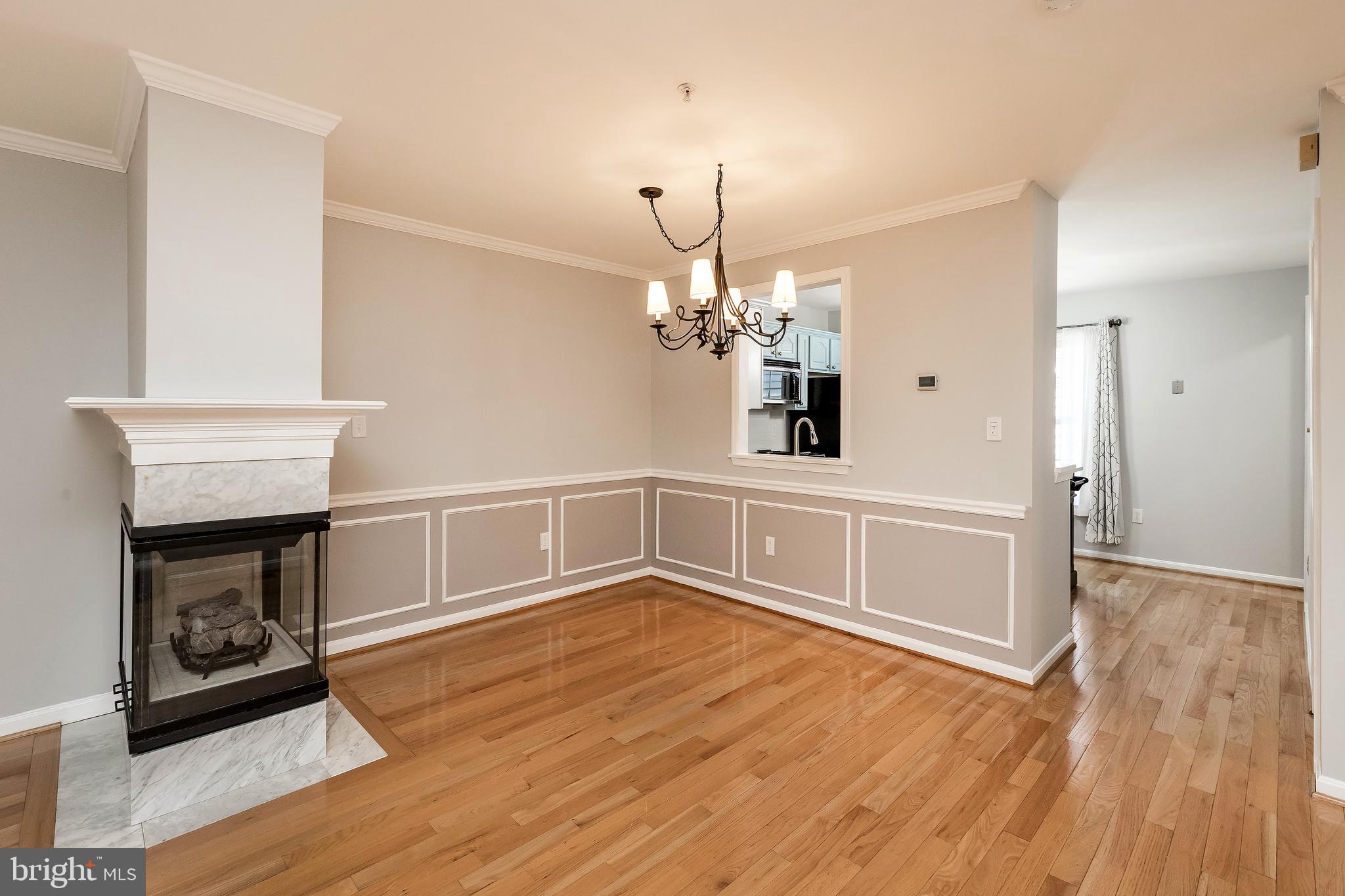 205 Ridgepoint Place Gaithersburg, MD 20878 - Photo 18 of 51 a view of a room with wooden floor and fireplace