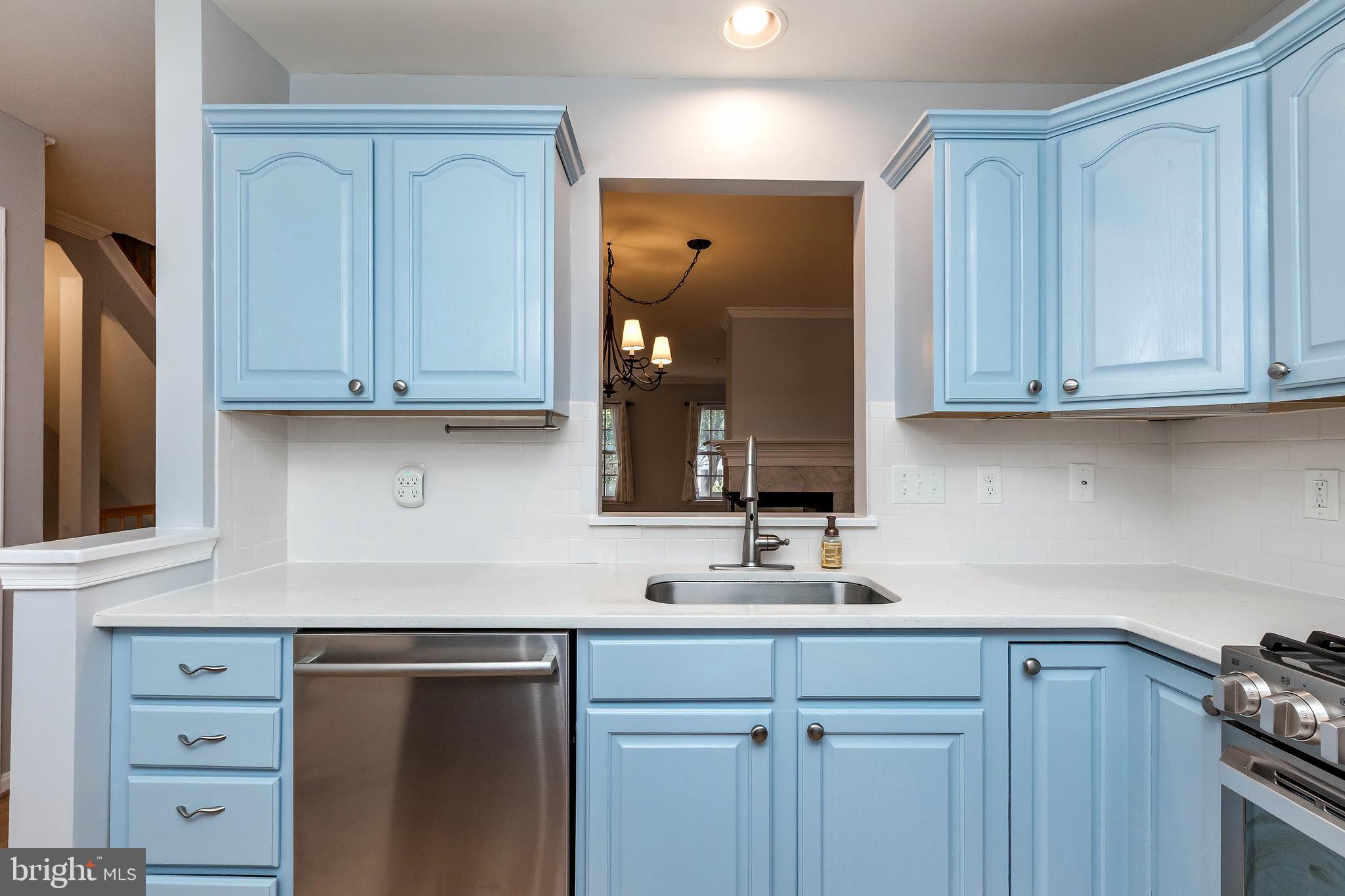 205 Ridgepoint Place Gaithersburg, MD 20878 - Photo 23 of 51 a kitchen with cabinets appliances and a counter space