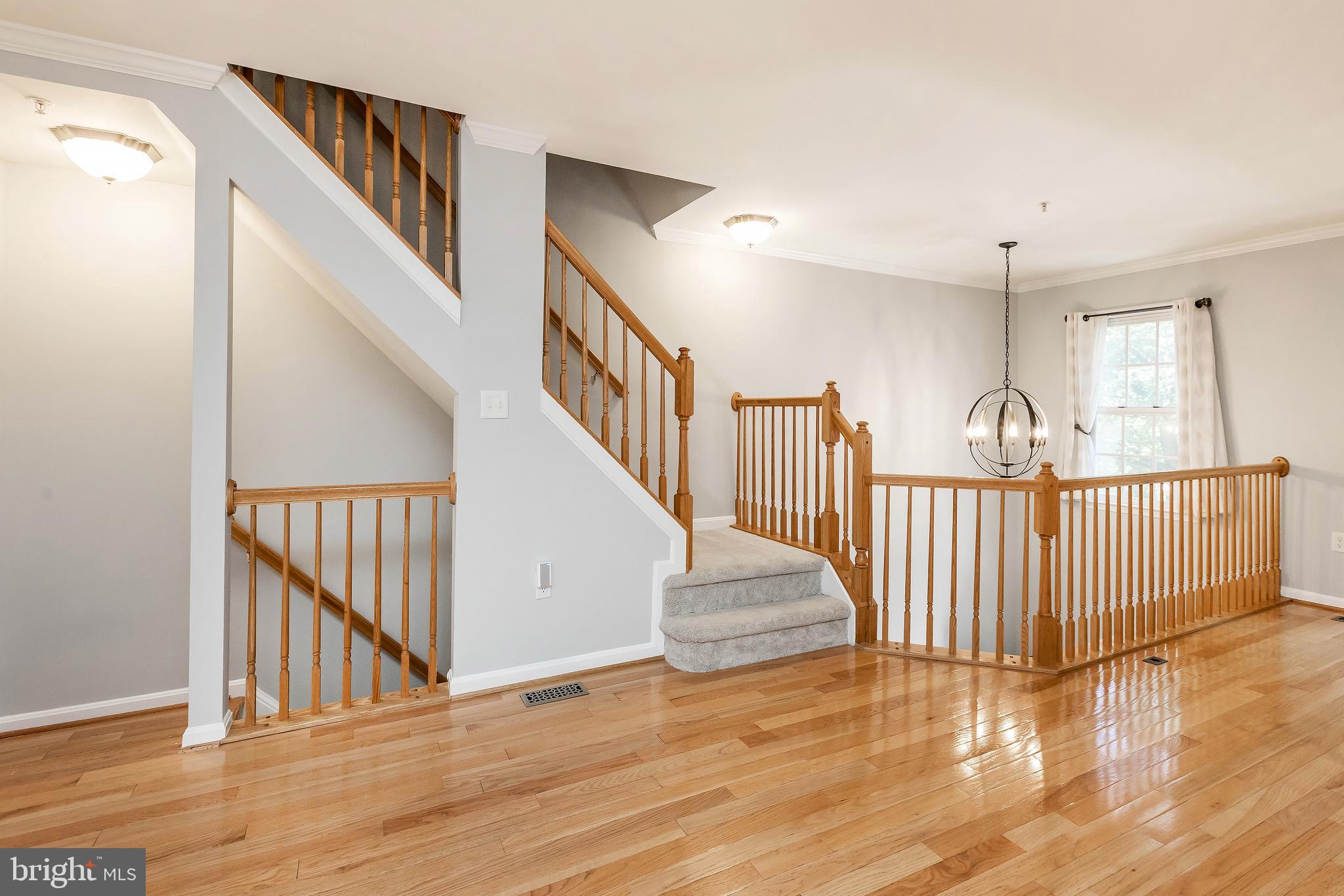 205 Ridgepoint Place Gaithersburg, MD 20878 - Photo 28 of 51 a view of staircase with railing and white walls