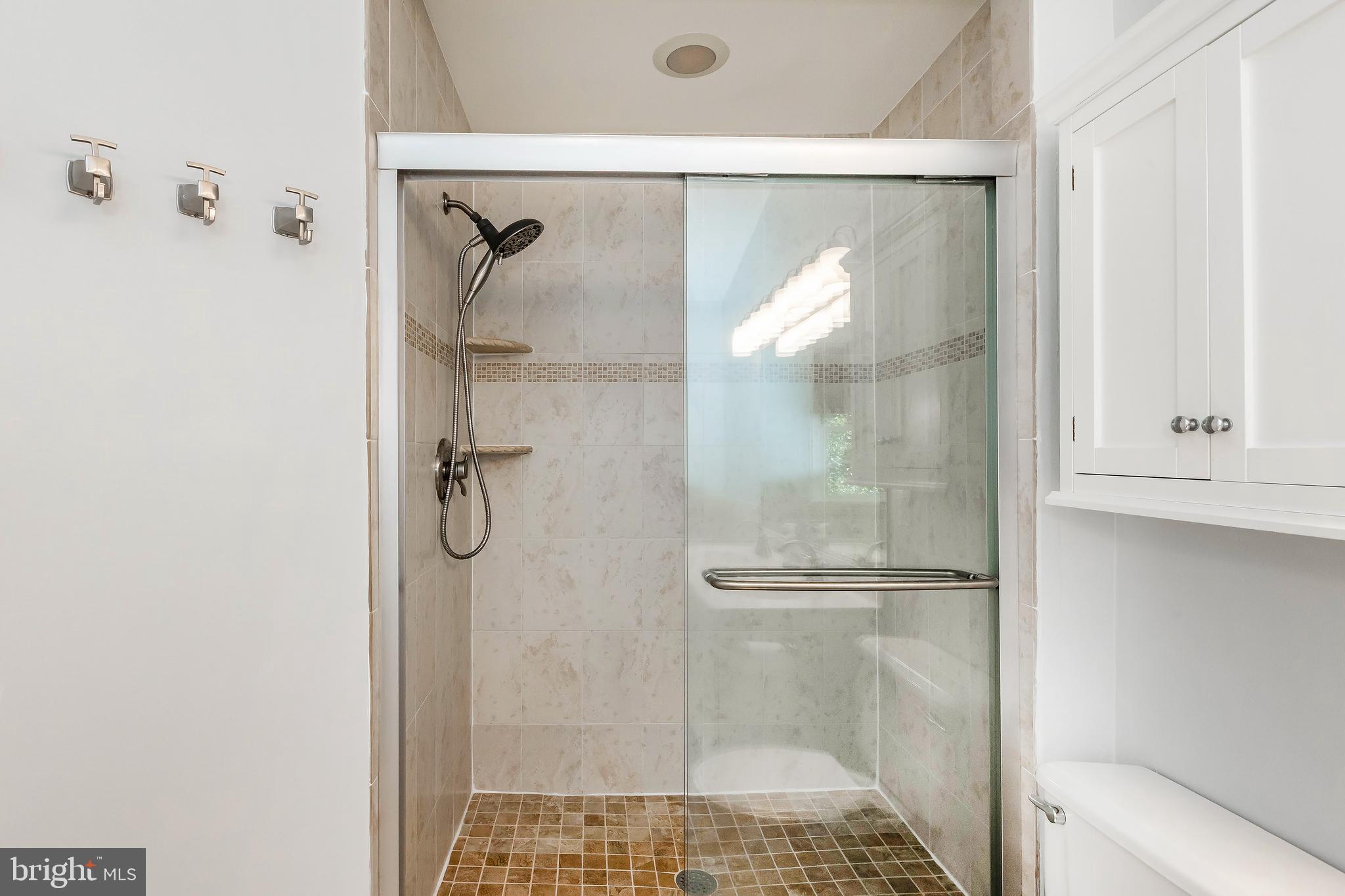 205 Ridgepoint Place Gaithersburg, MD 20878 - Photo 35 of 51 a bathroom with a glass shower door