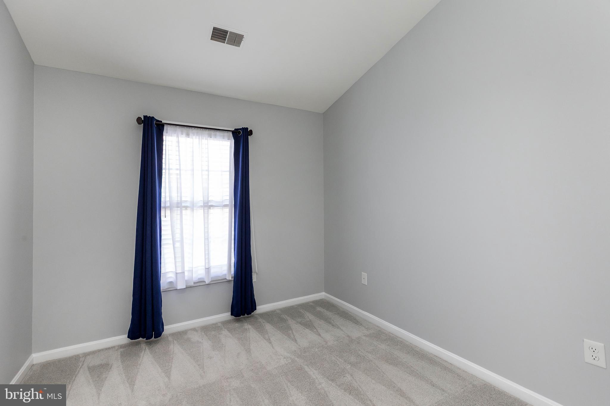 205 Ridgepoint Place Gaithersburg, MD 20878 - Photo 39 of 51 an empty room with windows