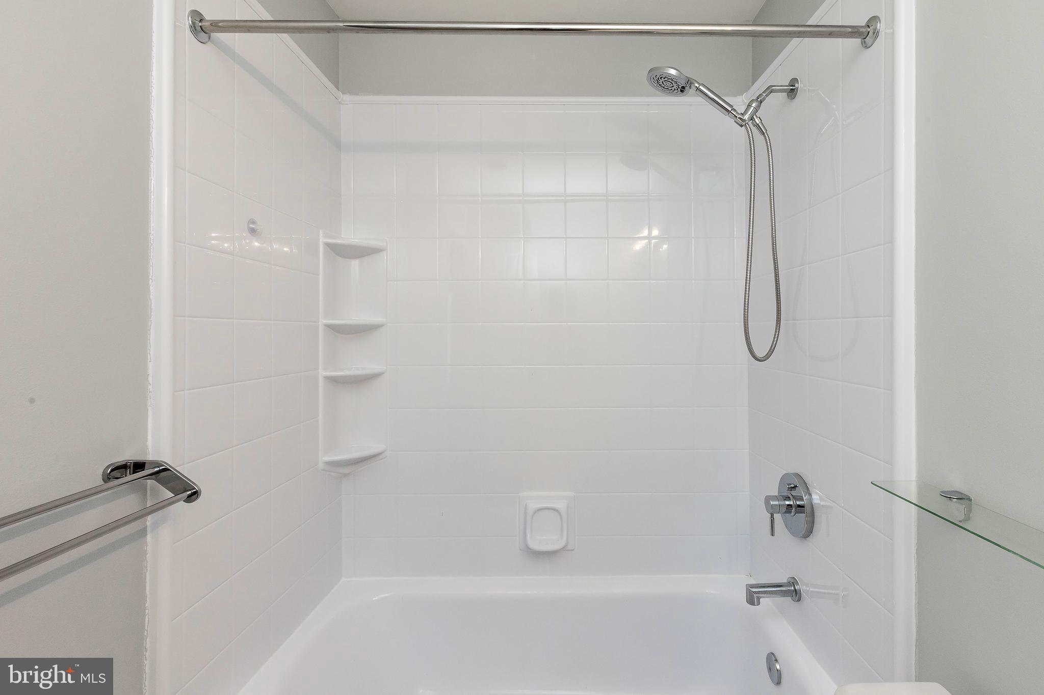205 Ridgepoint Place Gaithersburg, MD 20878 - Photo 43 of 51 a bathroom with a shower and a bath tub