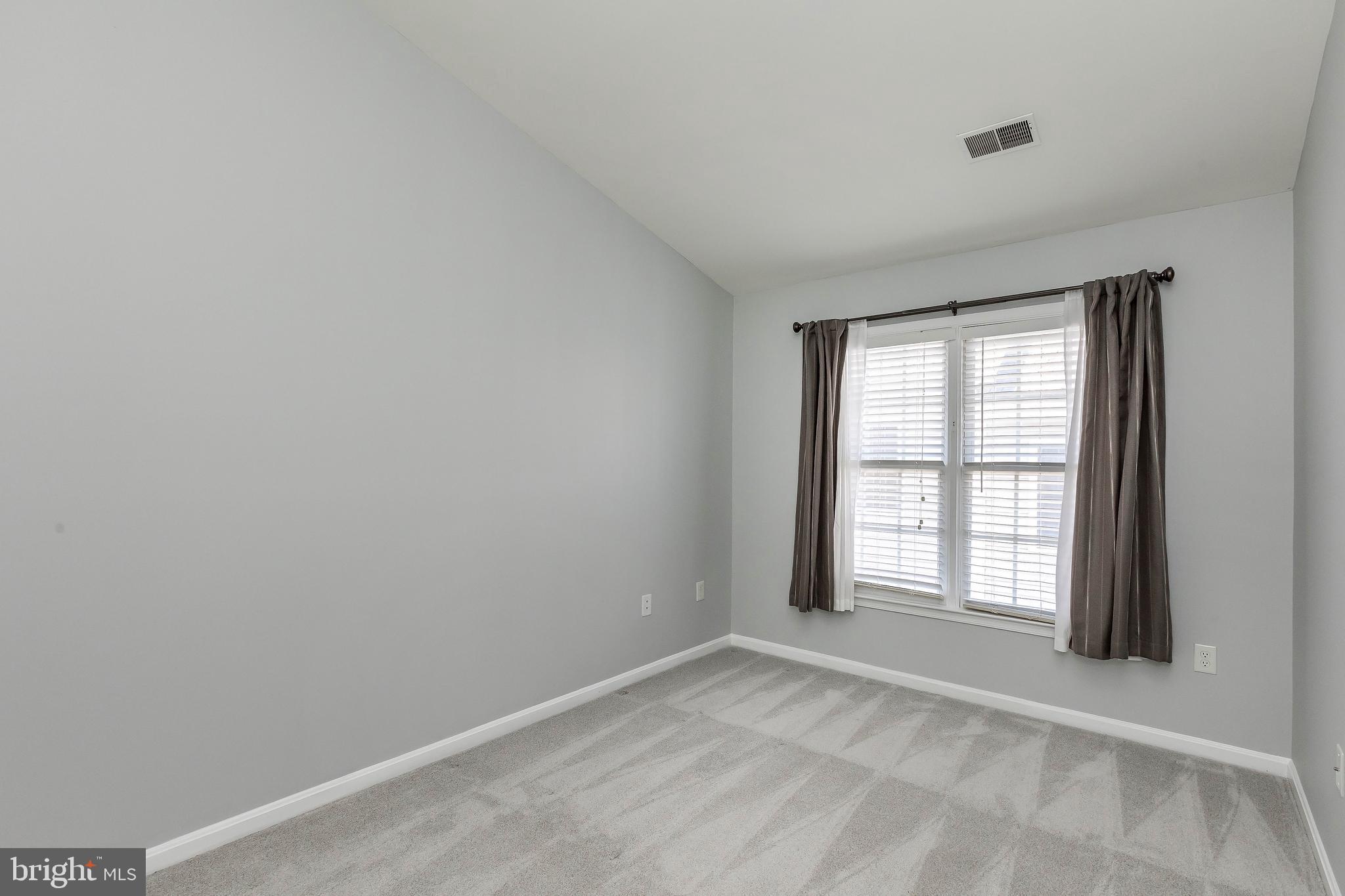 205 Ridgepoint Place Gaithersburg, MD 20878 - Photo 44 of 51 an empty room with a window