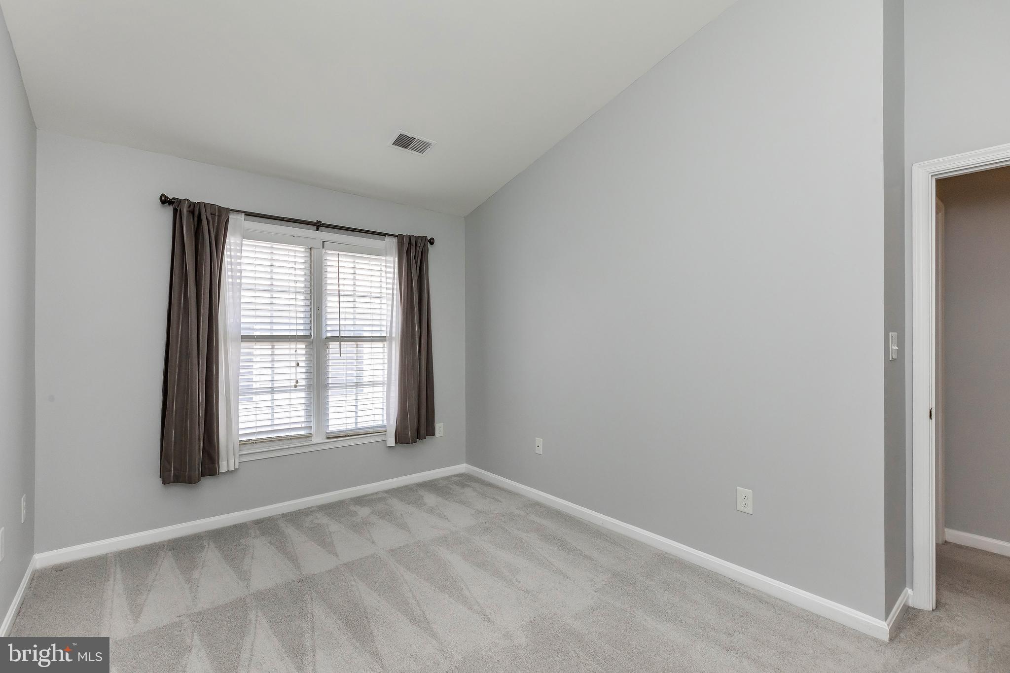 205 Ridgepoint Place Gaithersburg, MD 20878 - Photo 46 of 51 a view of an empty room with a window