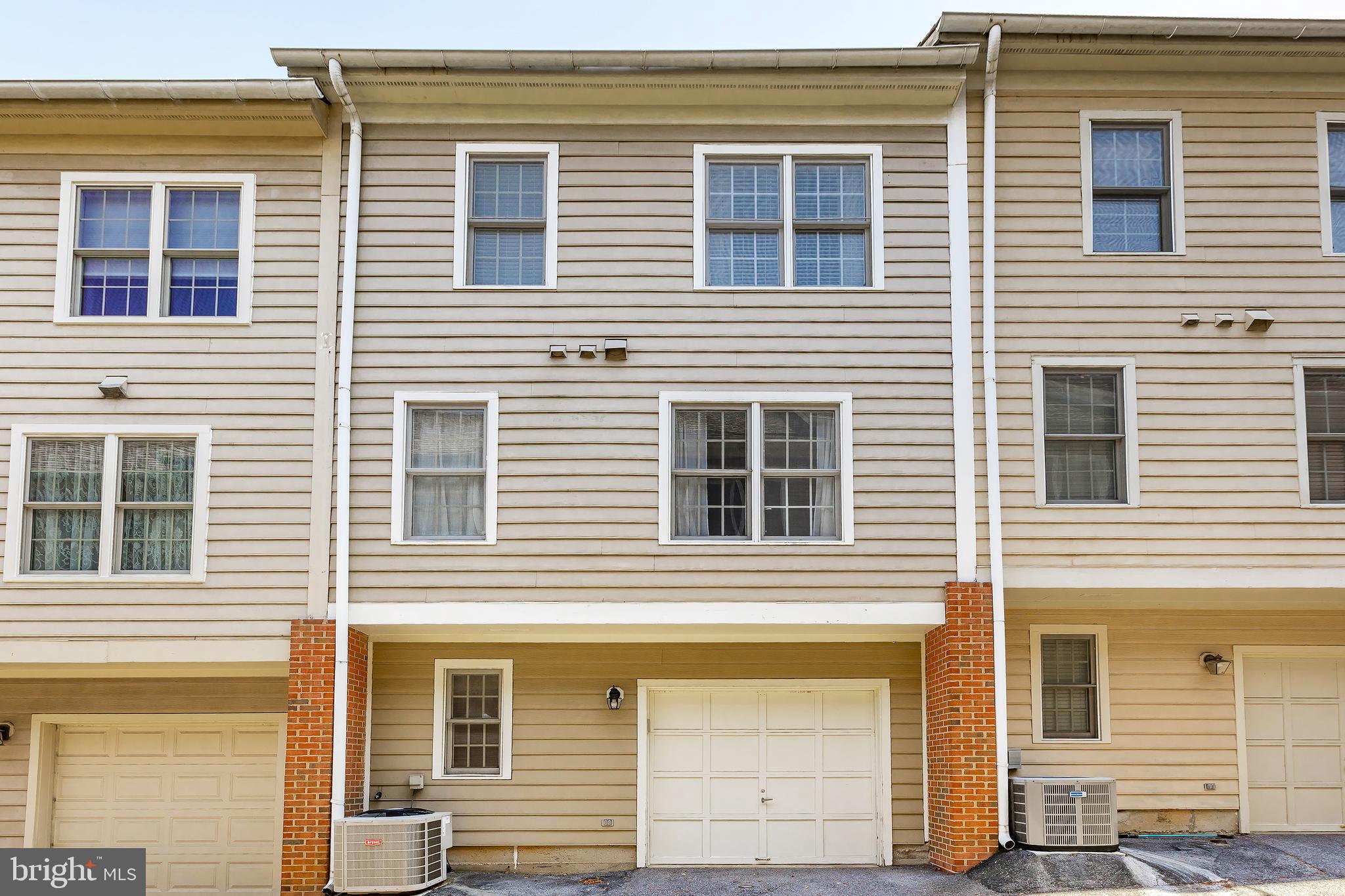 205 Ridgepoint Place Gaithersburg, MD 20878 - Photo 49 of 51 a view of a house with large windows