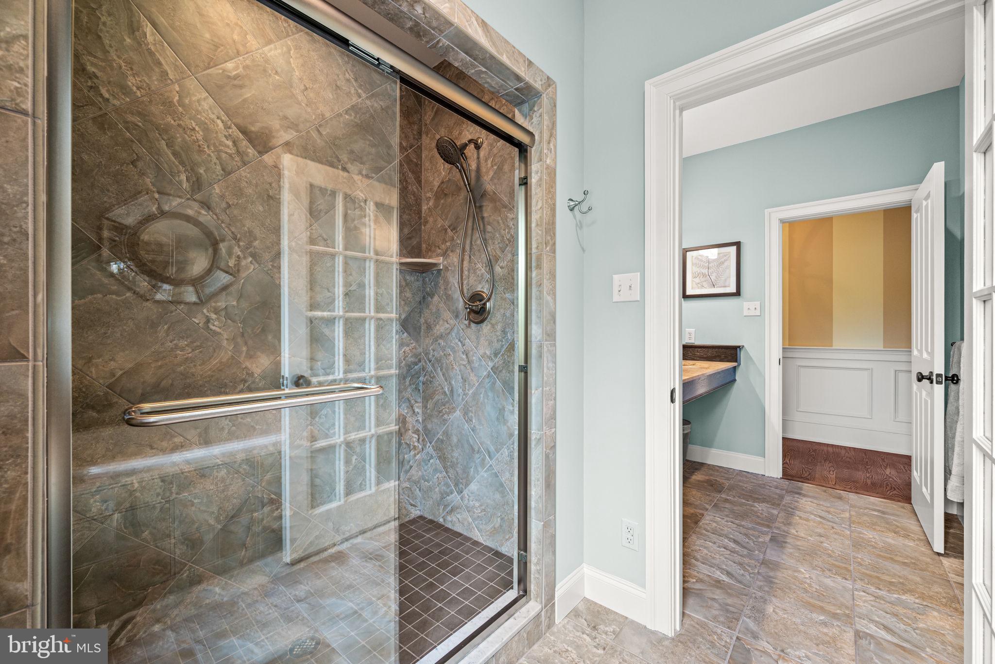 1548 Morstein Road Malvern, PA 19355 - Photo 52 of 80 a bathroom with a glass shower door