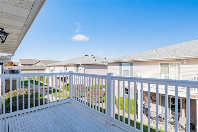 a view of a porch with wooden floor