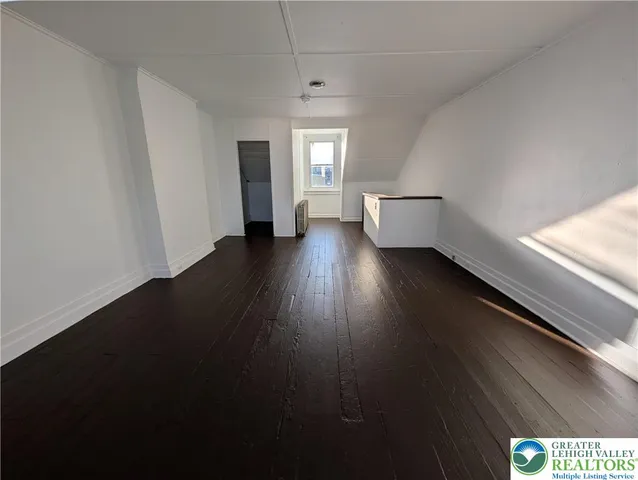 a view of an empty room and window