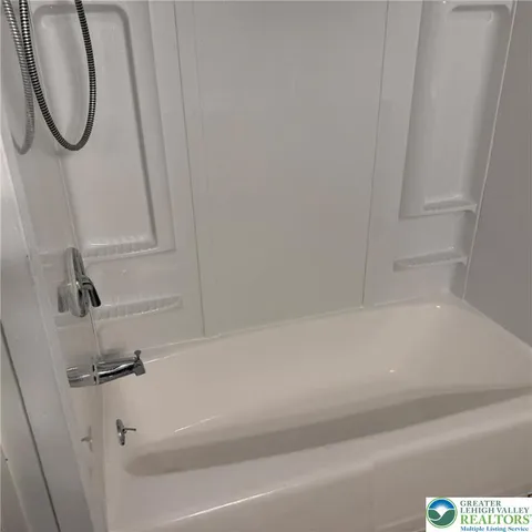 a bathroom with a bathtub