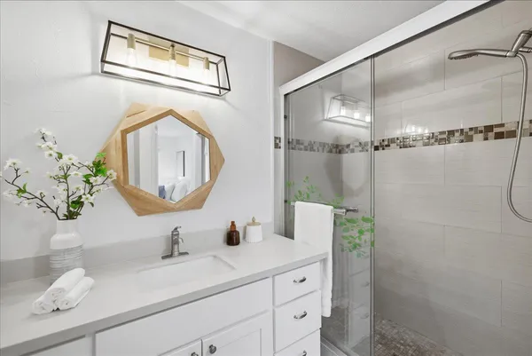 a bathroom with a sink and a mirror