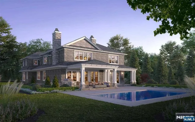 a front view of a house with a yard table and chairs