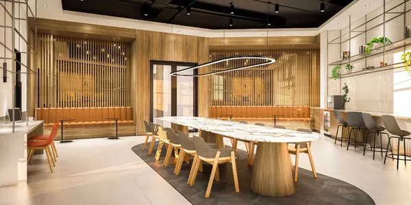 a view of kitchen with stainless steel appliances cabinets and empty room