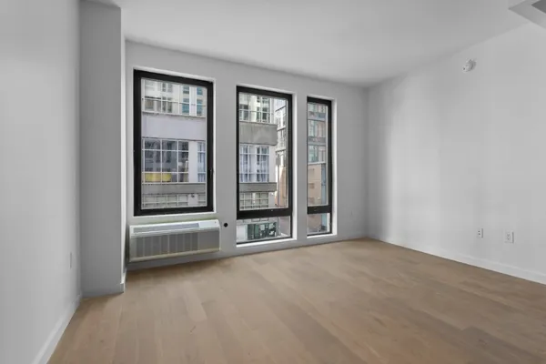 a kitchen with a refrigerator and a sink