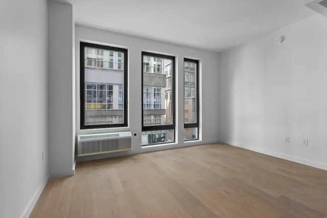a kitchen with a refrigerator and a sink
