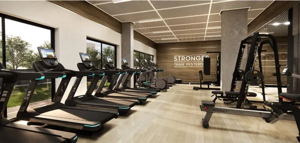 a living room with furniture and large windows