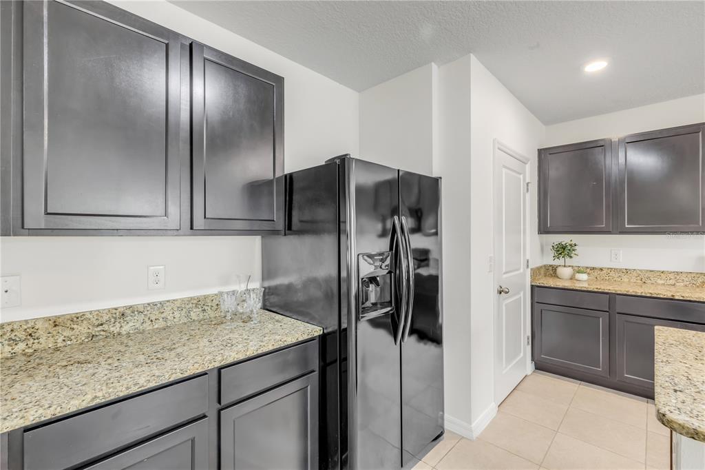 48 Hickory Loop Ocala, FL 34472 - Photo 15 of 52 a kitchen with a refrigerator and countertop