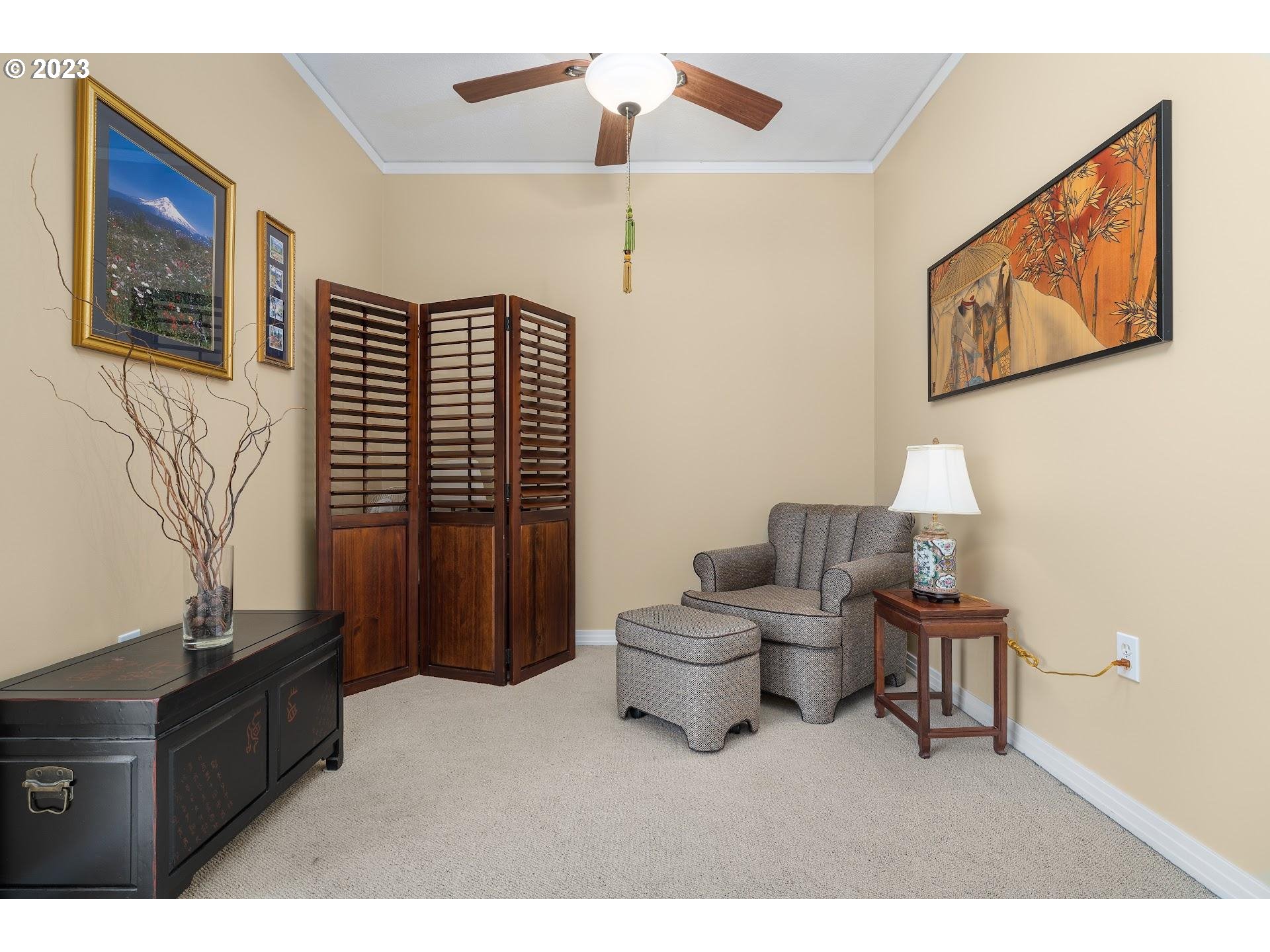 1132 Southwest 19th Avenue, Unit 406 Portland, OR 97205 - Photo 14 of 38 a living room with furniture and a window
