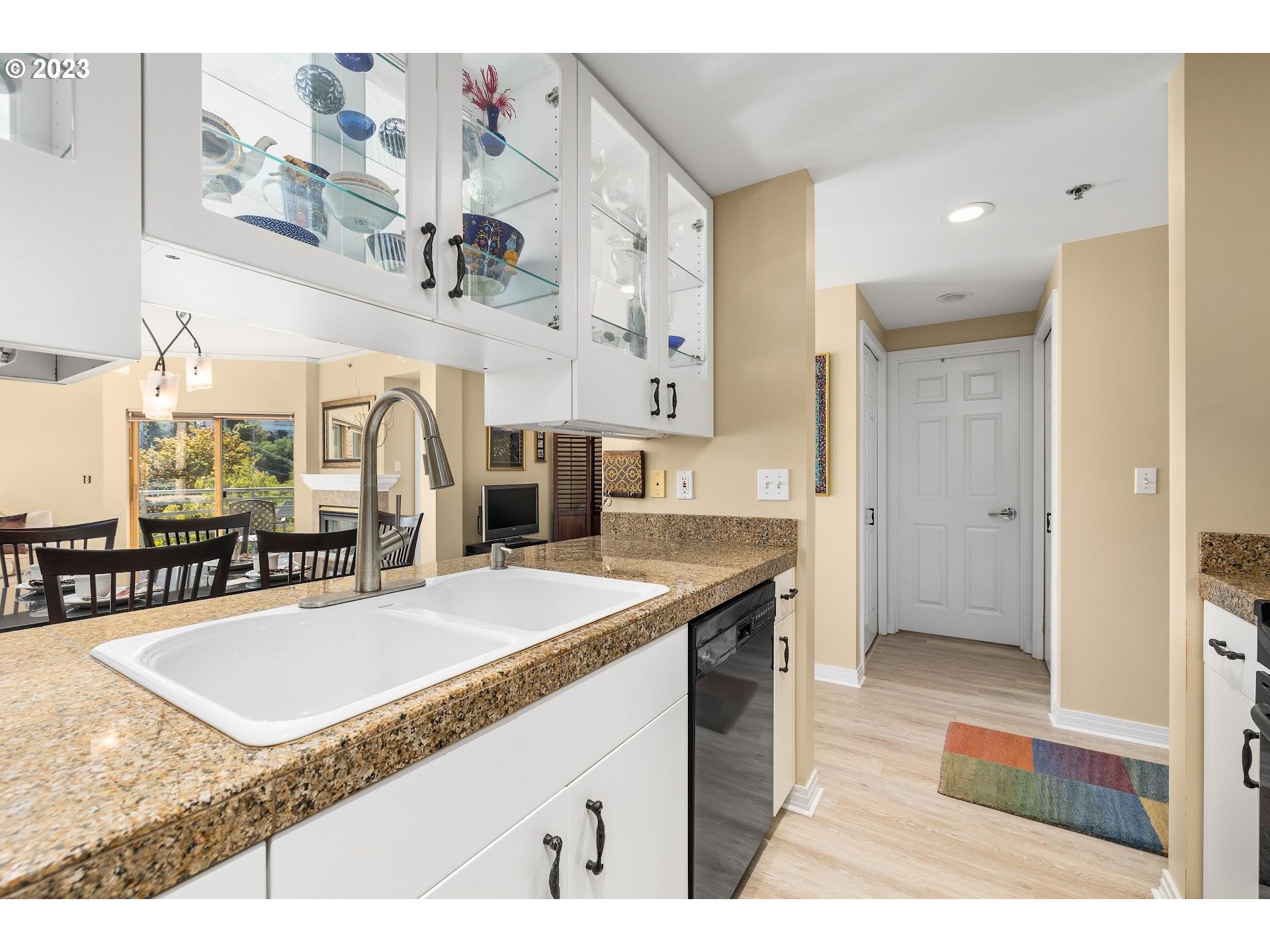 1132 Southwest 19th Avenue, Unit 406 Portland, OR 97205 - Photo 17 of 38 a bathroom with a tub sink and mirror