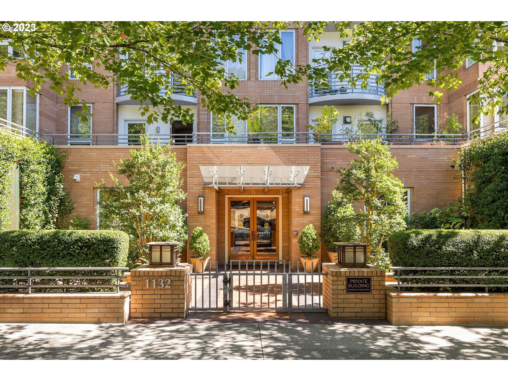 1132 Southwest 19th Avenue, Unit 406 Portland, OR 97205 - Photo 2 of 38 front view of a house with a garden