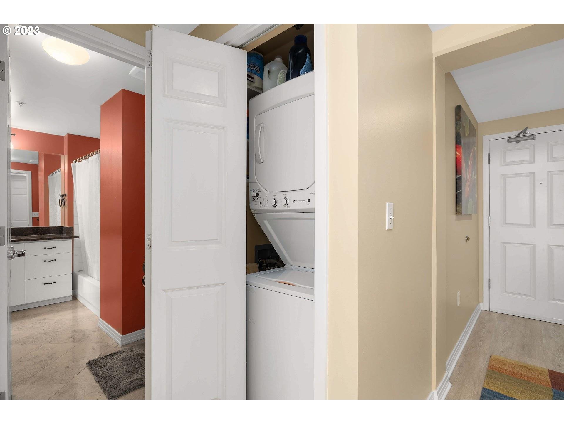 1132 Southwest 19th Avenue, Unit 406 Portland, OR 97205 - Photo 23 of 38 a view of a kitchen from the hallway