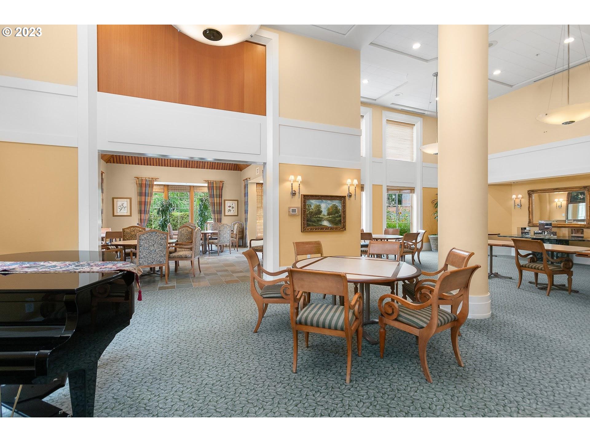 1132 Southwest 19th Avenue, Unit 406 Portland, OR 97205 - Photo 35 of 38 a dining room with furniture and a large window