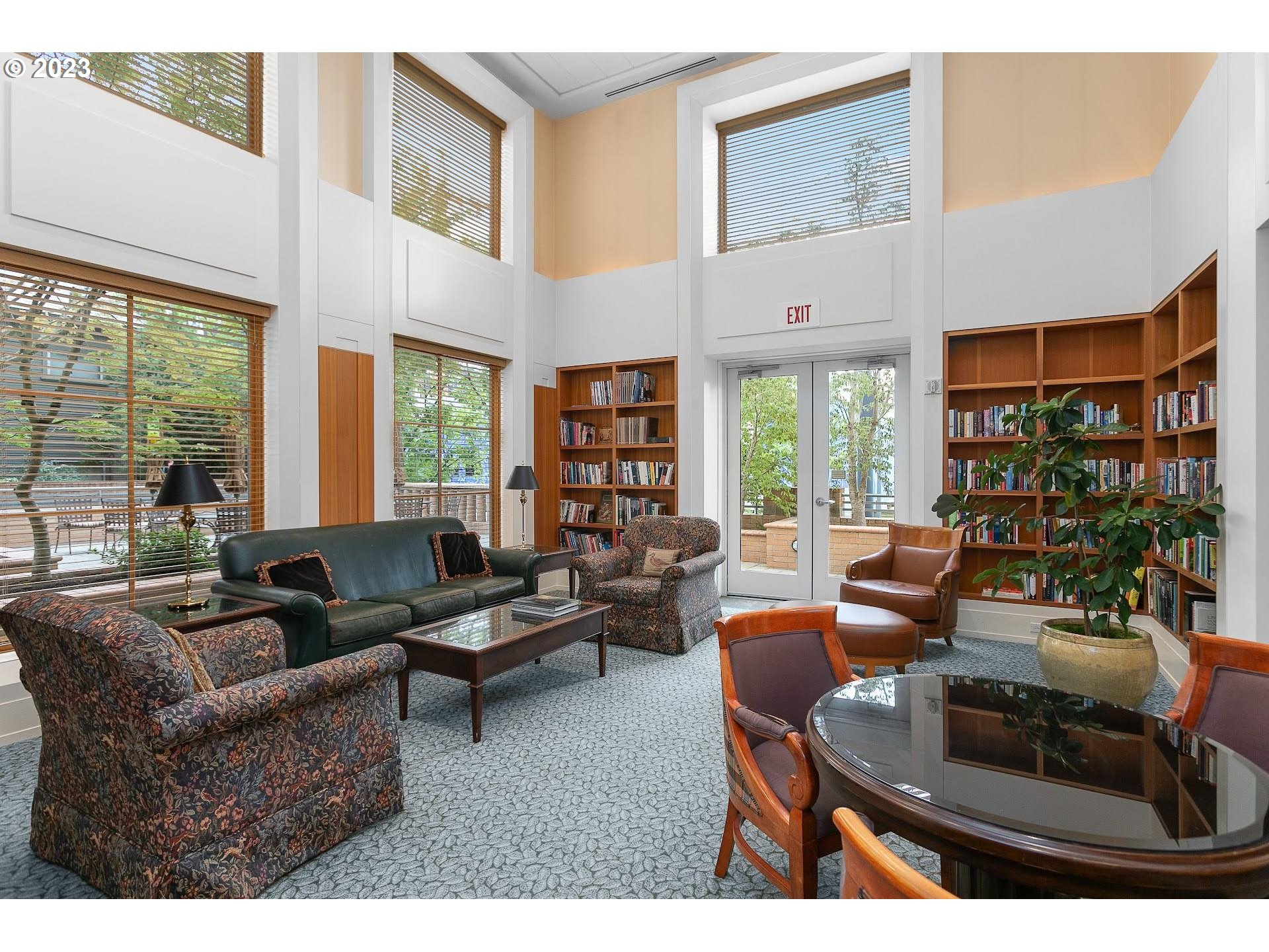 1132 Southwest 19th Avenue, Unit 406 Portland, OR 97205 - Photo 37 of 38 a living room with furniture and a large window
