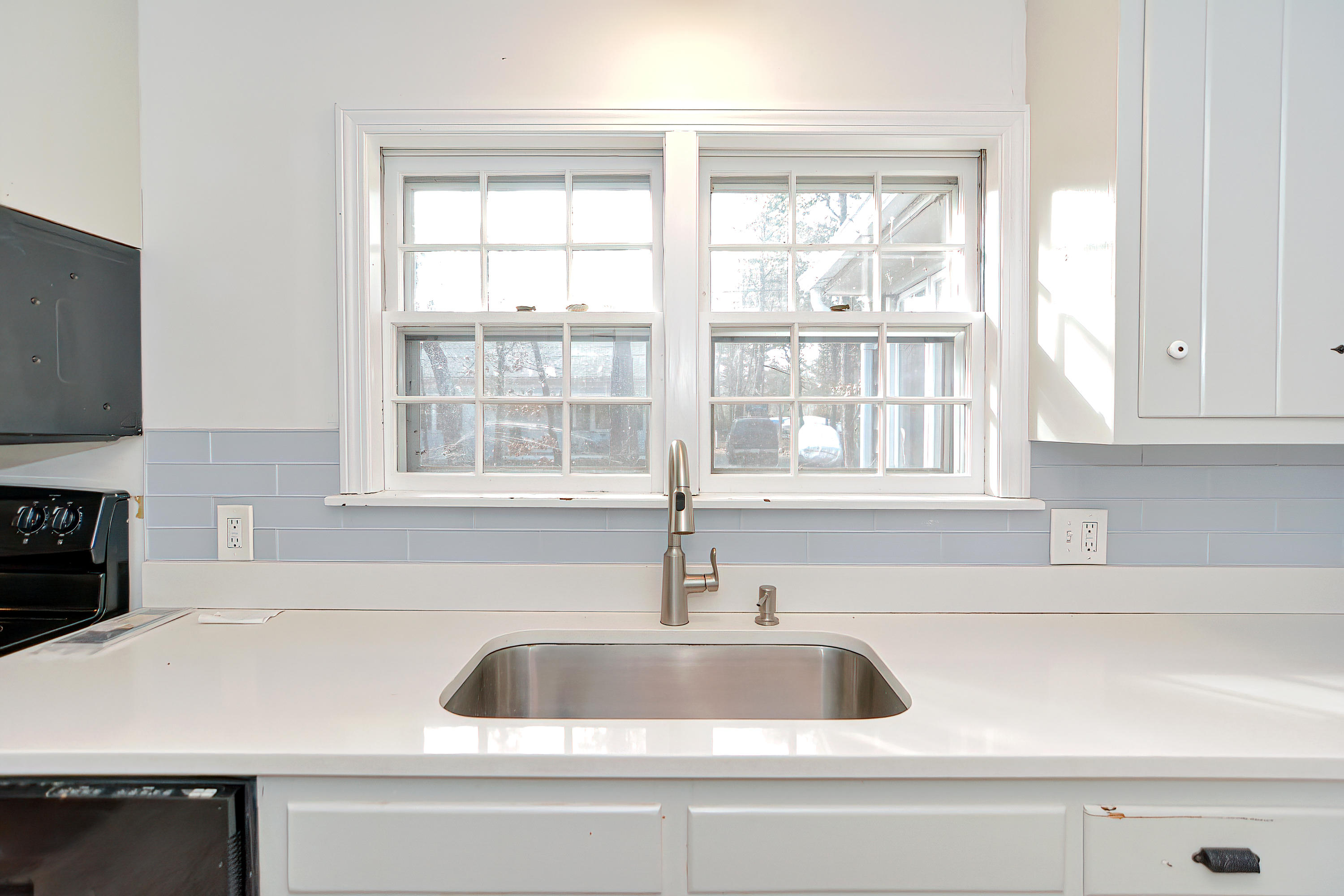 321 Monomoscoy Road Mashpee, MA 02649 - Photo 30 of 43 a kitchen with sink and window