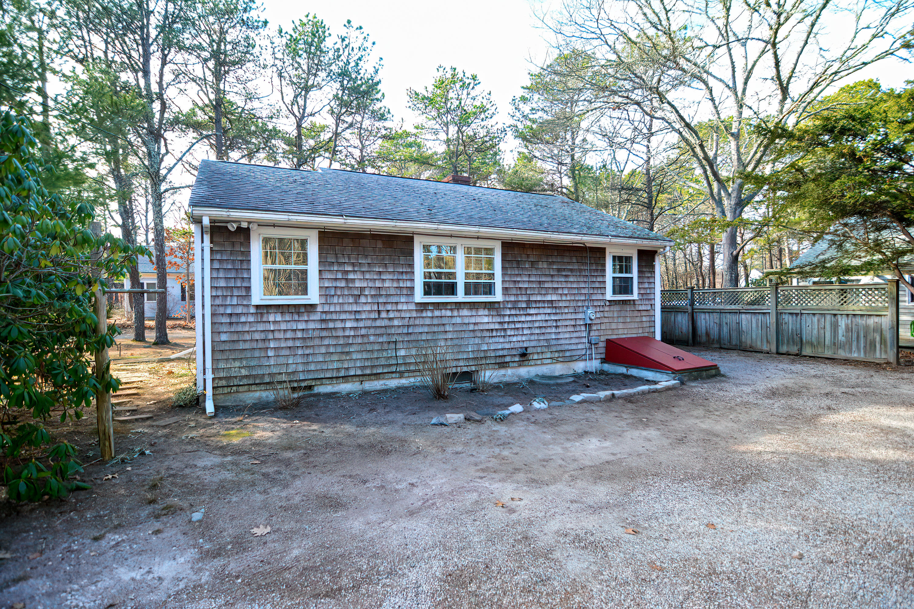 321 Monomoscoy Road Mashpee, MA 02649 - Photo 38 of 43 a view of a house with a yard and large tree