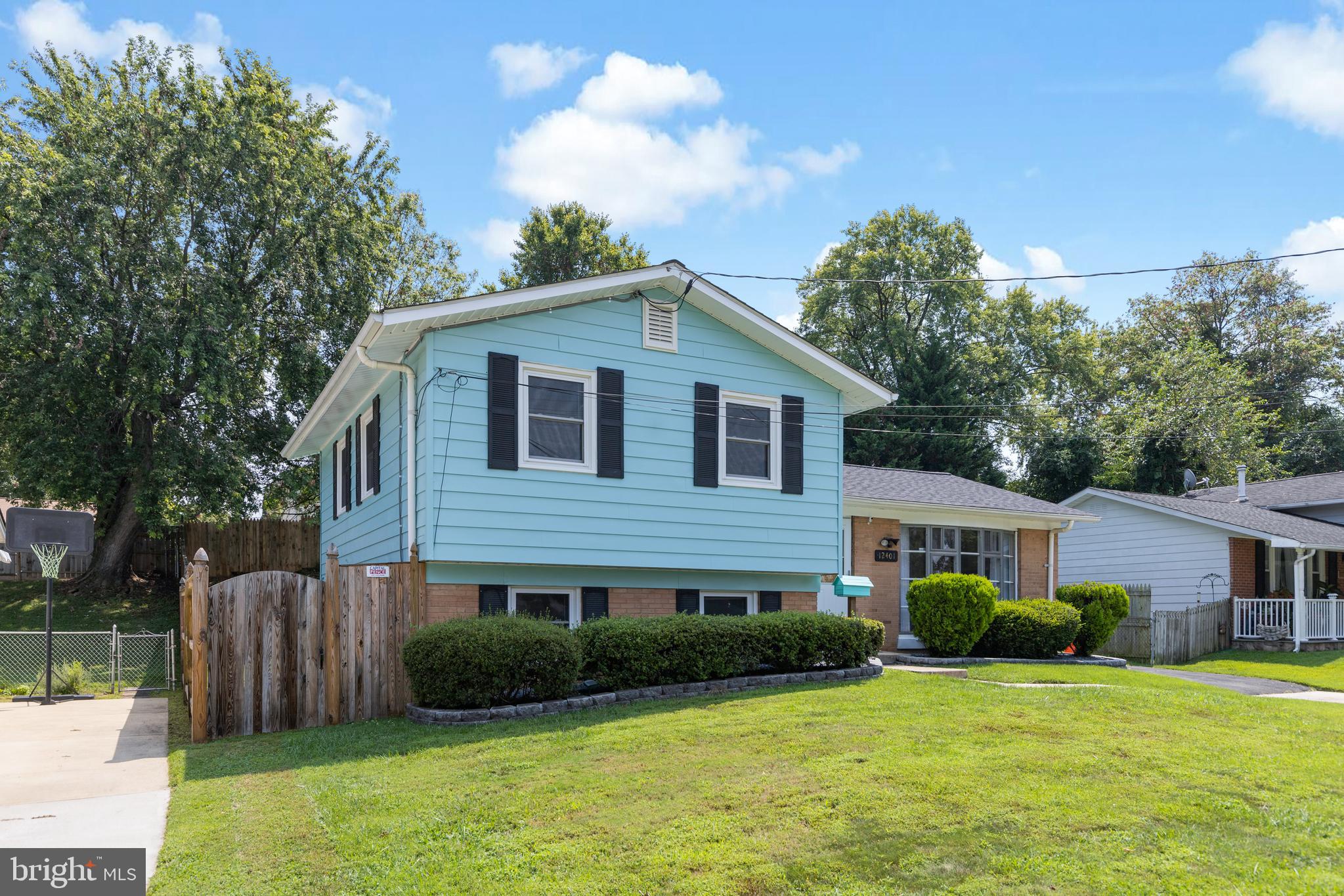 12401 Barbara Road Silver Spring, MD 20906 - Photo 1 of 17 a front view of a house with garden