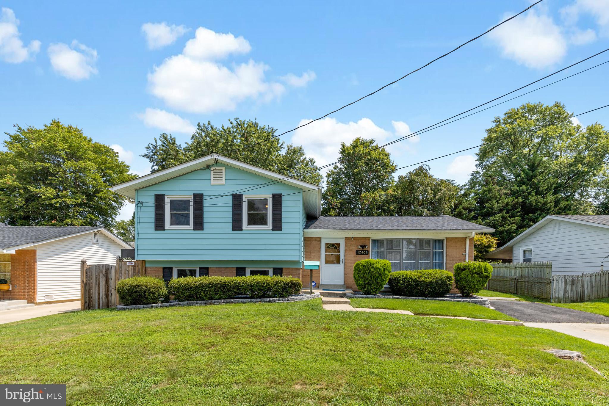 12401 Barbara Road Silver Spring, MD 20906 - Photo 2 of 17 a front view of a house with a garden