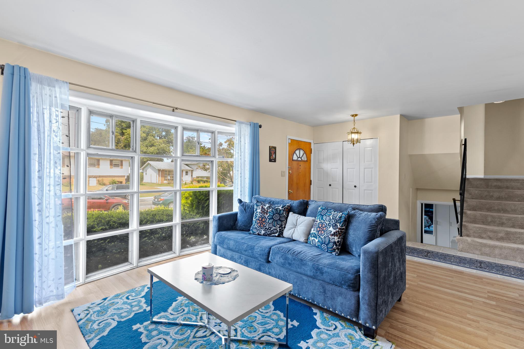 12401 Barbara Road Silver Spring, MD 20906 - Photo 3 of 17 a living room with furniture and a large window