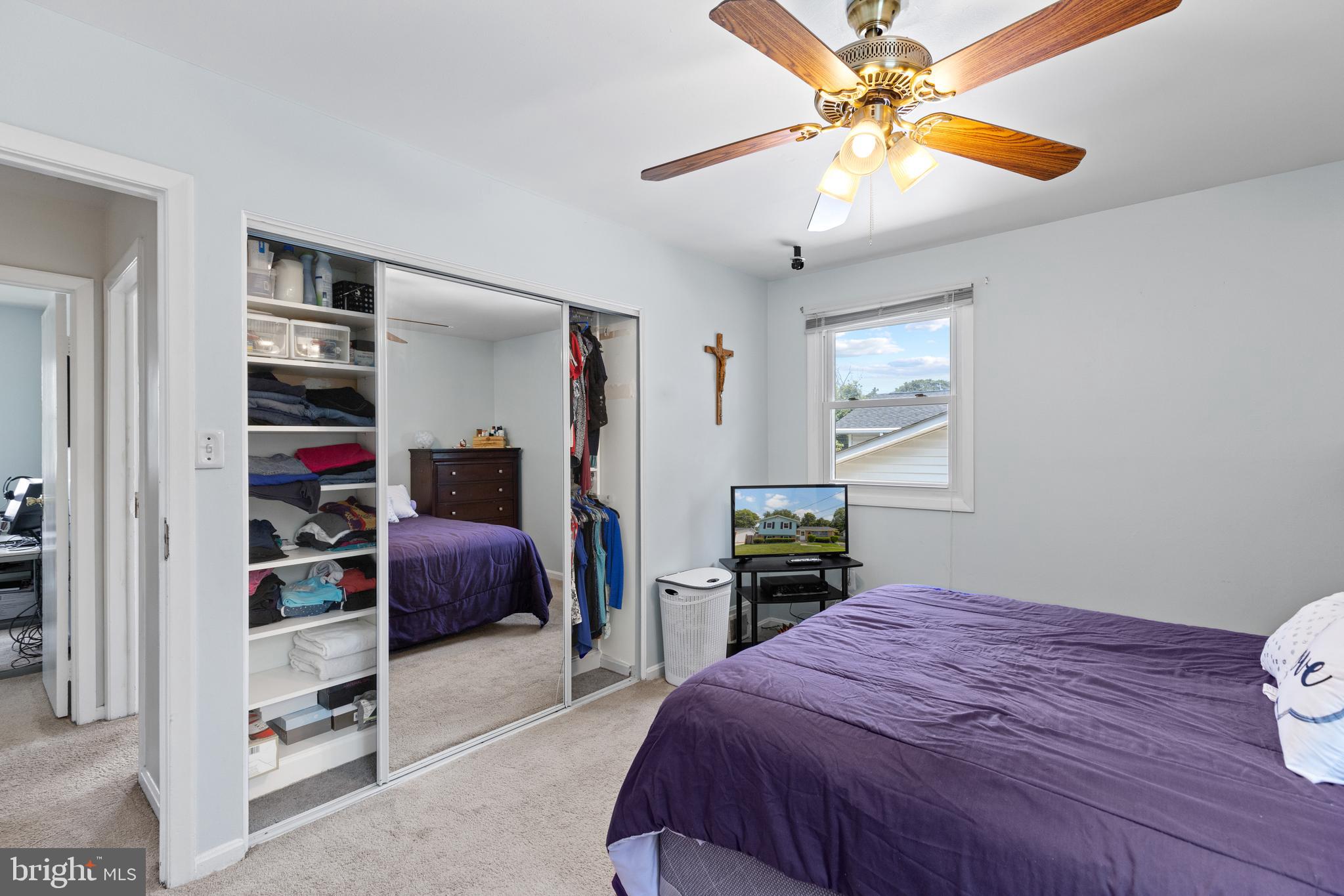 12401 Barbara Road Silver Spring, MD 20906 - Photo 10 of 17 a bedroom with a bed and a chandelier